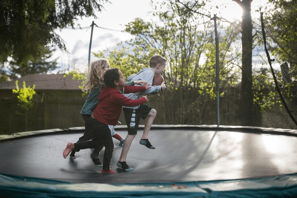 kids-playing-football-on-trampoline-600nw-1876279597